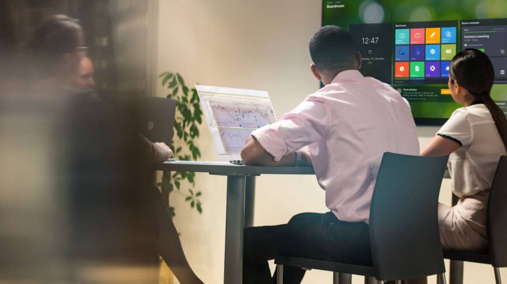 Launcher being used by a group of professionals in a meeting room