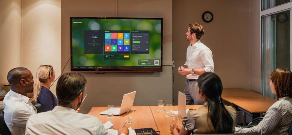 A group of colleagues using Launcher in a meeting room