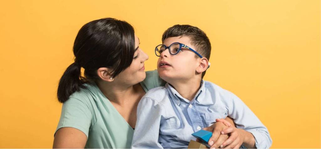 An image of a teacher assisting a child with sensory difficulties