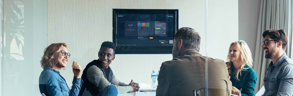 A group of people using DisplayNote's software on an Avocor screen