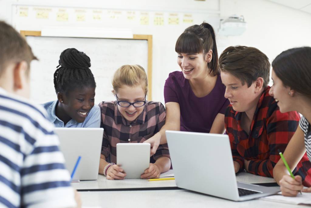 Students with teacher using ed tech in class