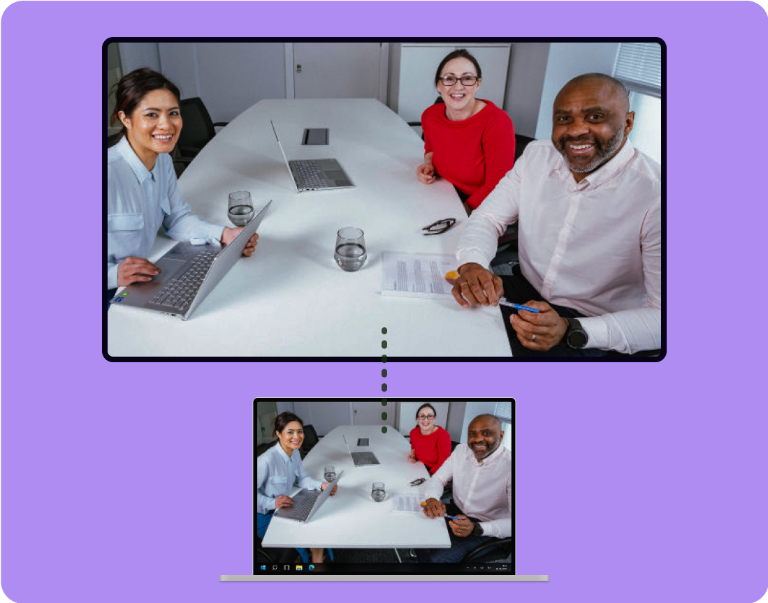 Image showing a happy meeting going on with users running the meeting from a laptop wirelessly connected to a meeting room screen using Omni