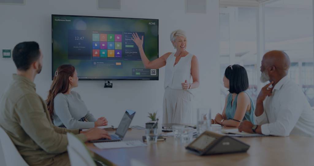 Launcher conference room technology being used by a group of colleagues in a meeting room